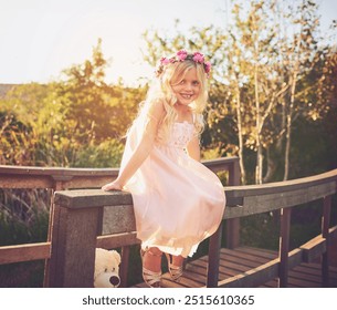 Girl, smile and portrait for fun, playful expression and backyard games with flower crown. Child, kid and youth with fairy dress up, nature or garden with spring costume for birthday celebration - Powered by Shutterstock