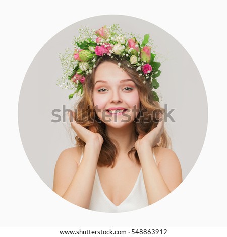 The girl with a smile in a wreath of pink and white roses. around a white background