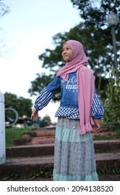 A Girl Smiling And Enjoy The Moment At The Park And Not Looking At The Camera