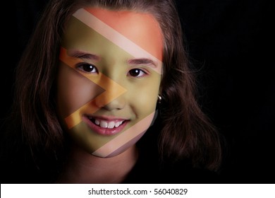 Girl Smiling And Looking At The Camera With South Africa Flag Paint In Her Face