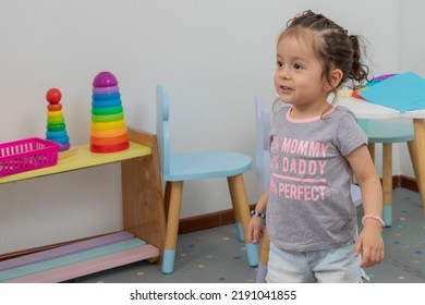 Girl Smiling In Play Area Of Pediatric Office