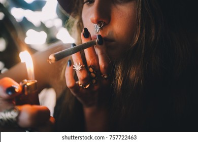 Girl Smoking Joint with Septum Ring - Shutterstock ID 757722463