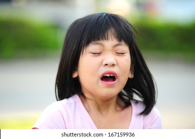 Girl Sneezing