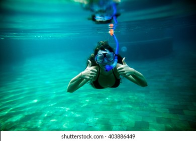 Girl Snorkel Underwater In Swimming Pool