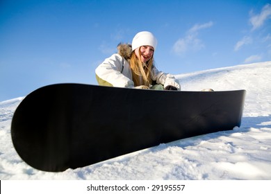 Girl With Snowboard Sit On Snow