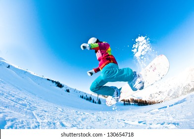 Girl Snowboarder Having A Great Time Jumping