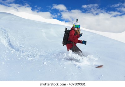 Girl Snowboarder Rides Fast On Loose Snow Freeride