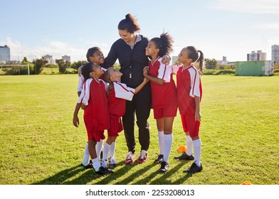 Girl, soccer group and field with coach, team building hug and solidarity at sport training. Female kids, sports diversity and happy with friends, teamwork and football coaching with mentor woman - Powered by Shutterstock