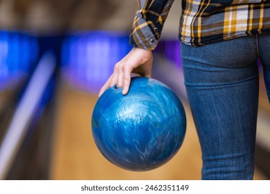 girl spending the afternoon bowling
