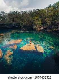 Girl Standing In A Cenote