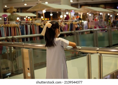 Girl Standing Idle In A Shopping Mall, Depressed Girl, Lost Girl In A Shopping Mall. The Sad Thoughtful Orphan Child Got Trauma, Feeling Depressed, Lonely, Upset. Thinking. Childhood Problems, Abuse, 