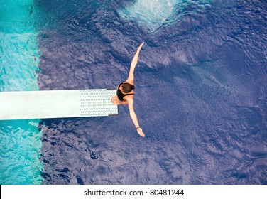 Girl Standing On Springboard, Preparing To Dive