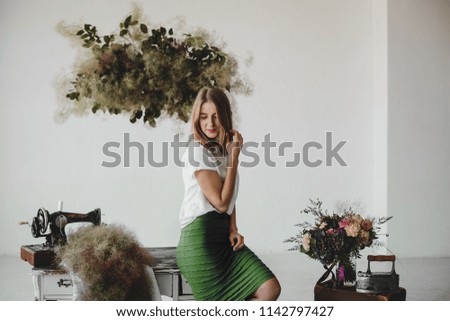 Similar – Woman holding vase with flowers