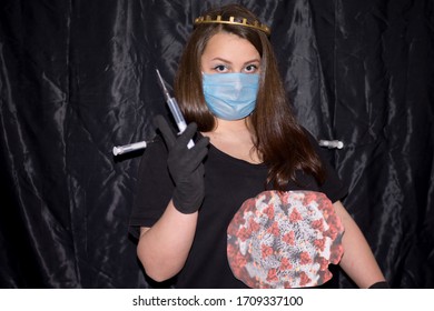 A girl stands on a black background with gloves and a crown on her head. Syringes are injected into it with a vaccine that does not kill the virus. The girl portrays the coronavirus as an invulnerable - Shutterstock ID 1709337100