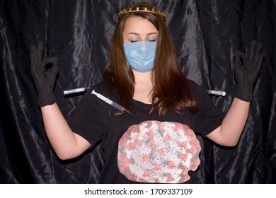 A girl stands on a black background with gloves and a crown on her head. Syringes are injected into it with a vaccine that does not kill the virus. The girl portrays the coronavirus as an invulnerable - Shutterstock ID 1709337109