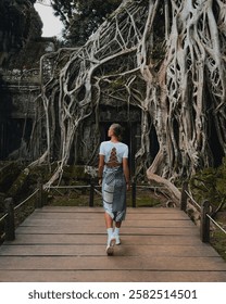 A girl stands at Ta Prohm – a location from the movie 