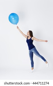 Girl Starts To Float Away With Blue Balloon