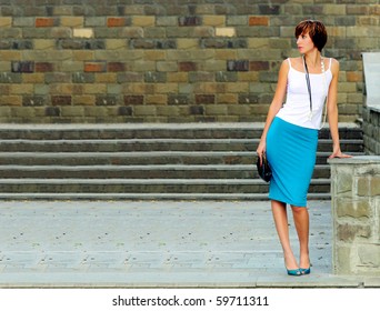 The girl at steps in city park