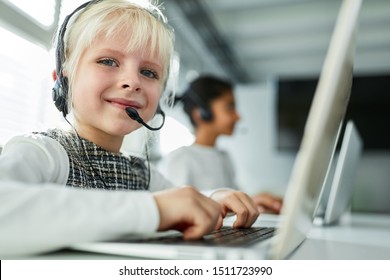 Girl As A Student At The Computer With Headset In A Language Course At School