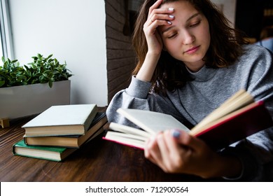 Girl Student Reading A Book