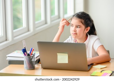 Girl Student She Is Studying Hard And Is Happy To Study Online With A Teacher Or Tutor From A Distance. For Education While Waiting For The School To Open. Concept : Online Learning Education.