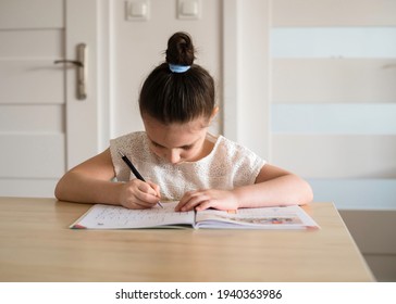 The Girl Studies At Home, The Concept Of Home Education And Preparation For The 1st Grade Of School. Close-up