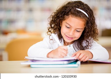 Girl studying at school looking very happy - Powered by Shutterstock