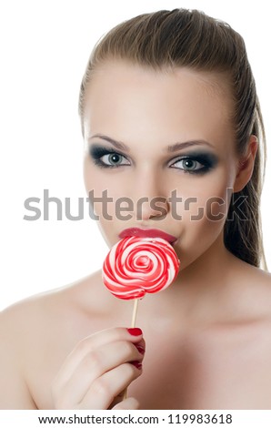 The girl with a sugar candy isolated