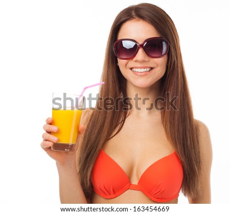 Girl with sunglasses drinks orange juice in summer, isolated on white