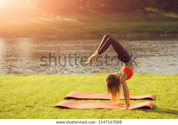 Girl Sunny Outdoor On Fitness Mat Royalty Free Stock Image