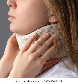 A Girl In A Supportive Neck Collar. Medical Corset For Fixing The Neck.