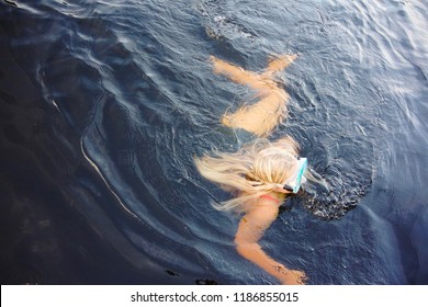 Girl Swimming In A Dark Lake