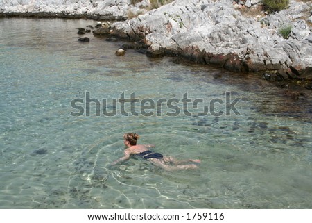 girl swimming in greece