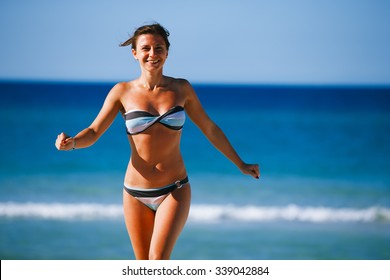 Girl swimming in paradise beach in Cuba