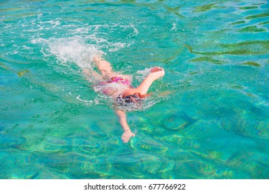 Girl swimming in the sea (clearwater)