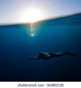 Girl Swimming Underwater