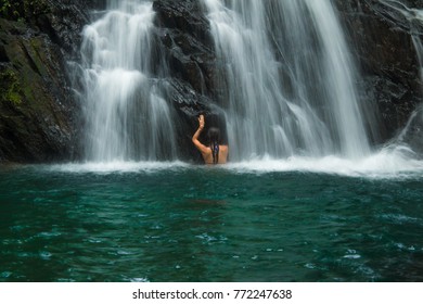 Woman In A Waterfall