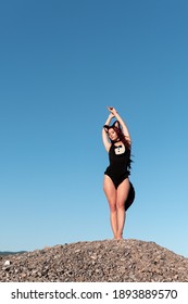  girl in a swimsuit with a ponytail and ears