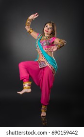 Girl takes the Indian folk dance in national costume