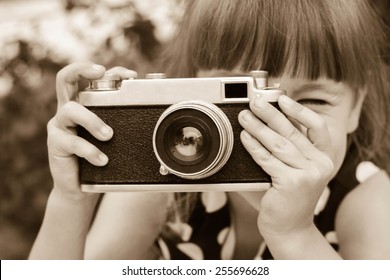 Girl Taking Photographs With Vintage Camera. Black And White Shot.   