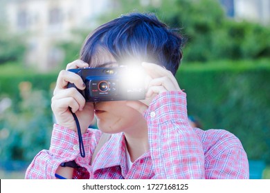 Girl Taking A Photography With Analogical Camera With Flash Light