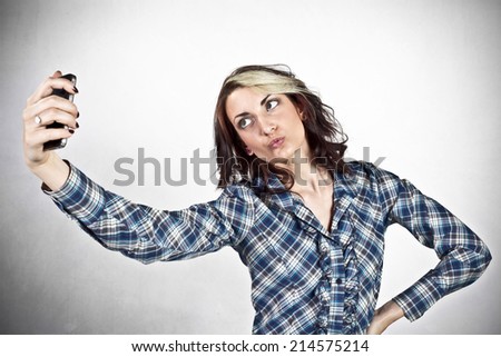 Girl taking self photo with smart phone