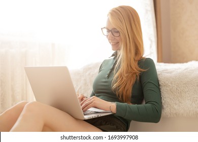 Girl Is Talking With Family In Group Video Chat With Friends Via Online Computer Web Cam. Concept Communication In Quarantine.