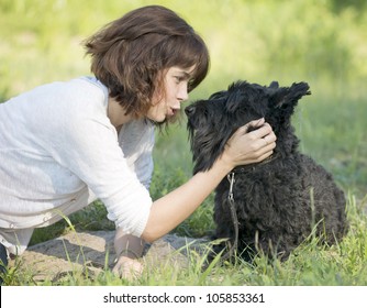 	The girl talks to a dog - Powered by Shutterstock