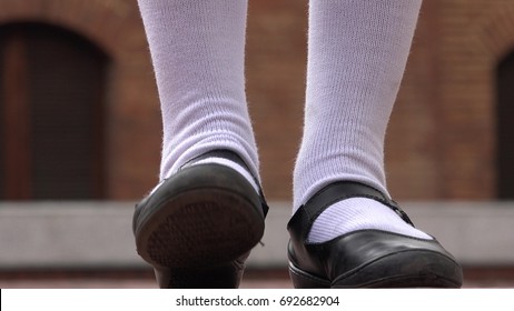 Girl Tapping Her Foot Wearing White Socks