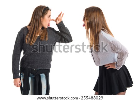 Girl teasing her sister