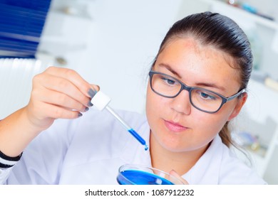 Girl Teen In The Laboratory Of Food Quality Tests.