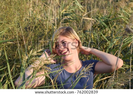 Similar – Lachend im Gras liegend, Augen geschlossen.