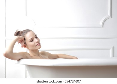 Girl thinking in the buthtub