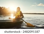 Girl, thinking and outdoor on lake or kayak or water sports, rowing and river journey on summer vacation. Woman, canoeing and travel on holiday in nature with sunshine, adventure and paddle for tour.